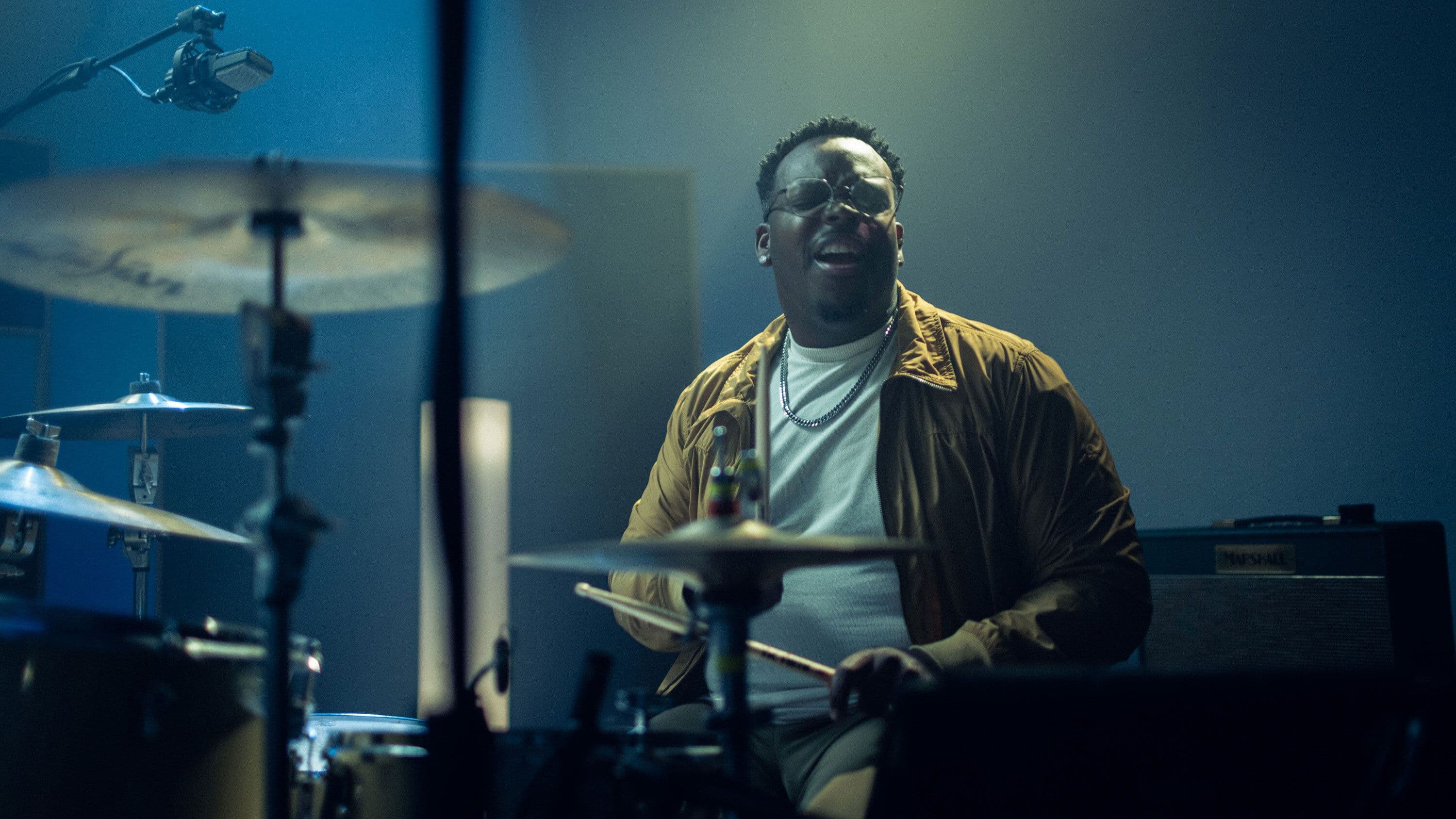 A drummer captured mid-performance, expressing the energy and raw emotion that make music creation deeply human. © 2025 Moises. All rights reserved.
